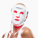 Woman using CurrentBody Red Light LED Face Mask Series 2 on her face